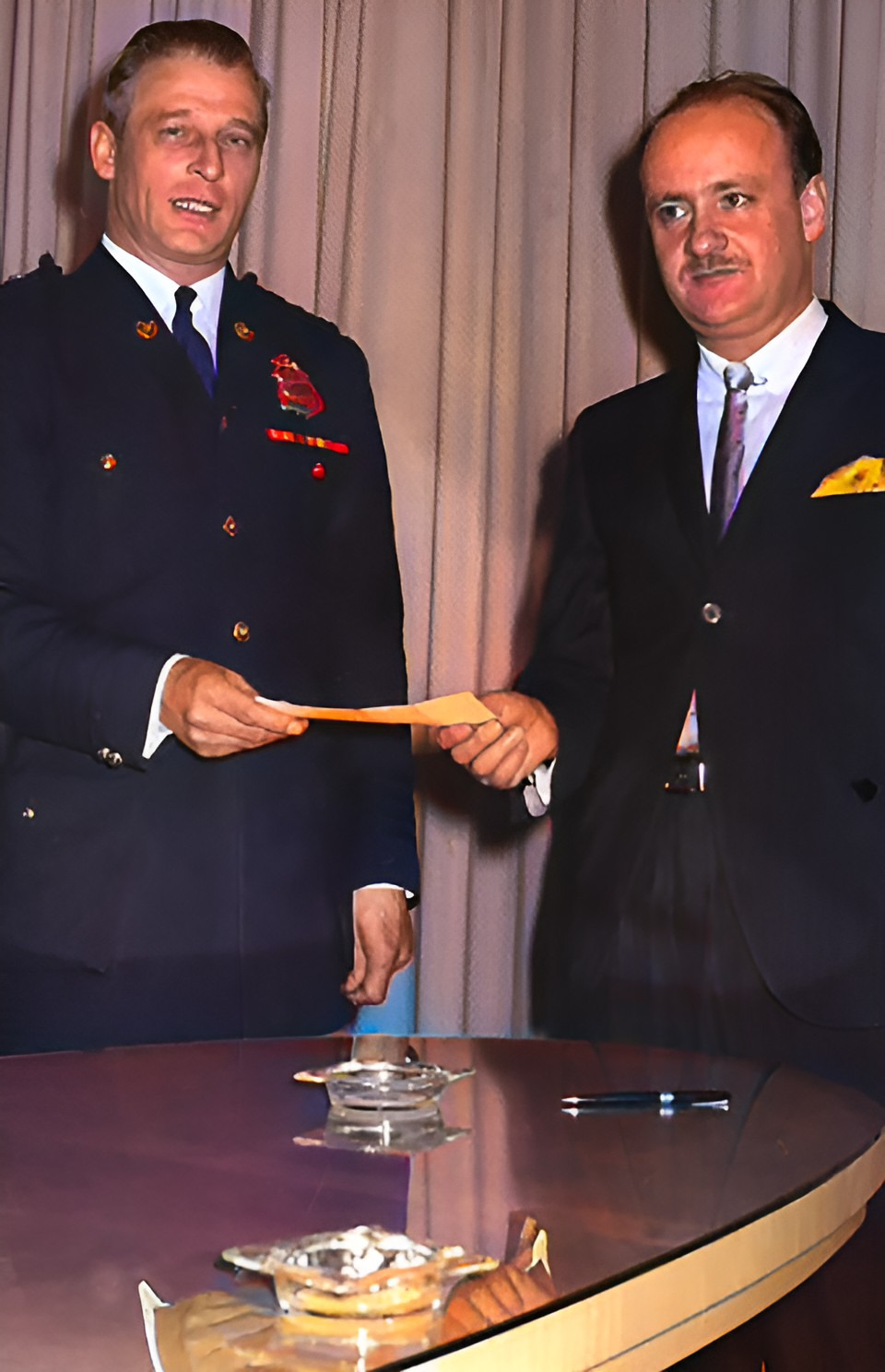 Police Chief Albert Bell, on left, alias Al Benny circus performer, boxer, photographer and inventor.